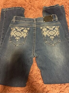 True Religion Blue Bootcut Jeans with White Embroidered Back Pockets